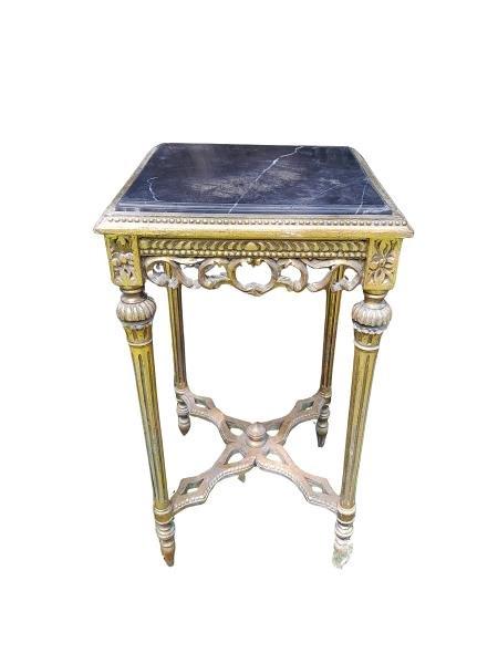 A French Style Ornately Carved Giltwood Table With A Marble Top