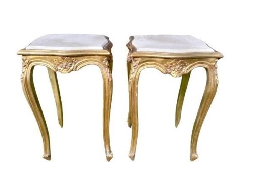 A Pair Of French Style Ornately Carved Giltwood Tables With Cream Marble Tops
