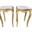 A Pair Of French Style Ornately Carved Giltwood Tables With Cream Marble Tops