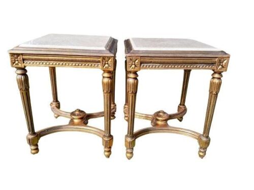 A Pair Of French Style Ornately Carved Giltwood Side Tables With Cream Marble Tops