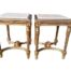 A Pair Of French Style Ornately Carved Giltwood Side Tables With Cream Marble Tops