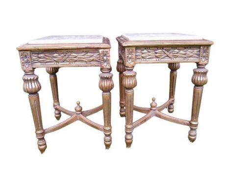 A Pair Of French Style Ornately Carved Giltwood Side Tables With Cream Marble Tops