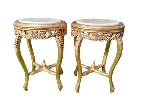A Pair Of French Style Carved Giltwood Tables With Cream Marble Tops