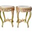 A Pair Of French Style Carved Giltwood Tables With Cream Marble Tops