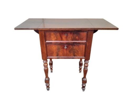 An Antique 19th Century French Mahogany Table With Drawers And Drop Sides