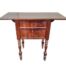An Antique 19th Century French Mahogany Table With Drawers And Drop Sides