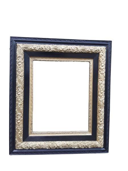 A French Style Gilt And Ebonised Mirror