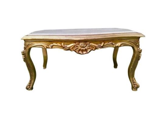 A French Style Carved And Giltwood Coffee Table With A Marble Top