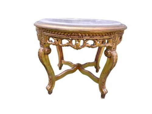 A French Style Carved Giltwood Table With A Cream Marble Top