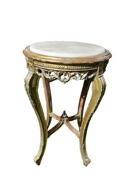 A French Style Carved Giltwood Table With A Cream Marble Top