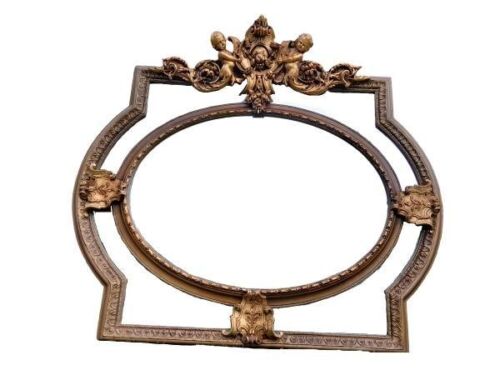 An Ornate Rococo Style Carved Giltwood And Mirror