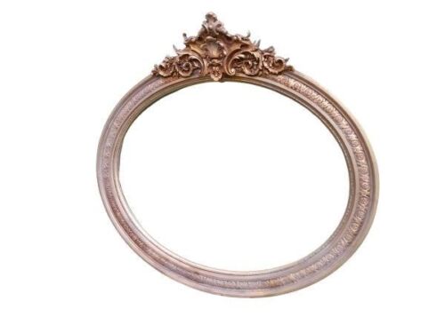 An Ornate Rococo Style Carved Giltwood And Bevelled Mirror