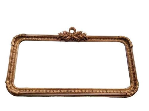 An Ornate Rococo Style Carved Giltwood And Bevelled Mirror