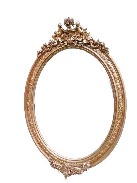 An Ornate Rococo Style Carved Giltwood And  Bevelled Mirror