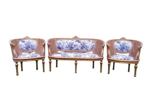A French Style Giltwood & Rattan Ornately Carved Settee With A Pair Of Armchairs In French Blue And White Toile Fabric