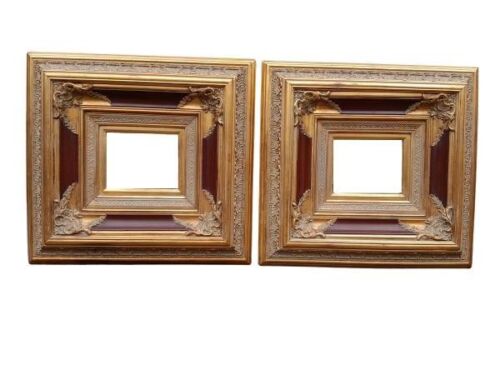 A 20TH Century Pair Of Baroque Style Bevelled Mirrors In Ornate Caved Gilt- Wood Frames