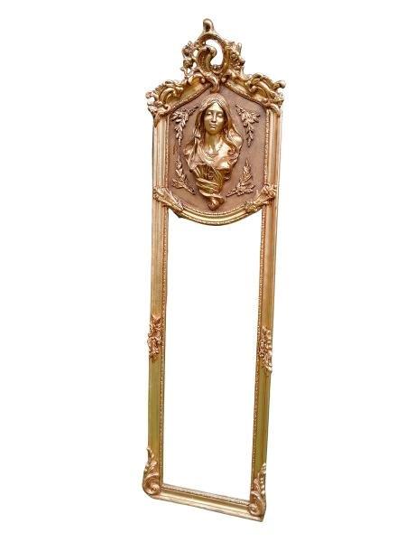 A French Ornate Rococo Style Carved Giltwood And Bevelled Mirror With Lady Head Figure
