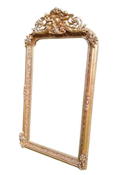 An Ornate Rococo Style Carved Giltwood And Bevelled Mirror