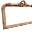 An Ornate Rococo Style Carved Giltwood And Bevelled Mirror