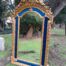 An Ornate Rococo Style Carved Giltwood And Bevelled Mirror With Royal Blue Suede Inner Lining