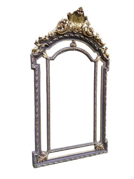 An Ornate Rococo Style Carved Giltwood And Bevelled Mirror