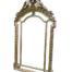 An Ornate Rococo Style Carved Giltwood And Bevelled Mirror