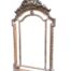 An Ornate Rococo Style Carved Giltwood And Bevelled Mirror