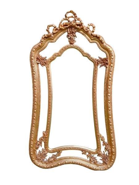 An Ornate Rococo Style Carved Giltwood And Bevelled Mirror