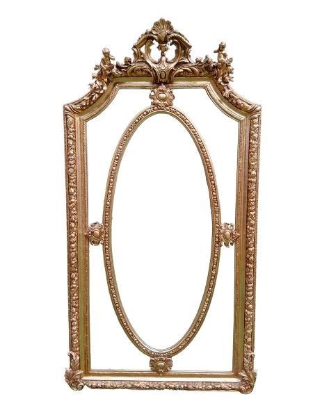 An Ornate Rococo Style Carved Giltwood And Bevelled Mirror