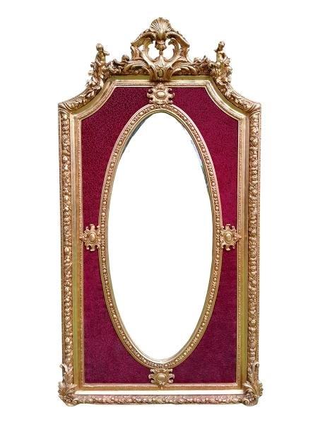An Ornate Rococo Style Carved Giltwood And Bevelled Mirror With Burgandy Inner Lining