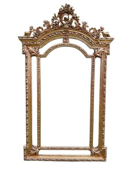 An Ornate Rococo Style Carved Giltwood And Bevelled Mirror