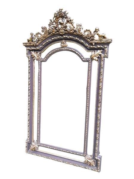 An Ornate Rococo Style Carved Giltwood And Bevelled Mirror