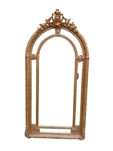 An Ornate Rococo Style Carved Giltwood And Bevelled Mirror