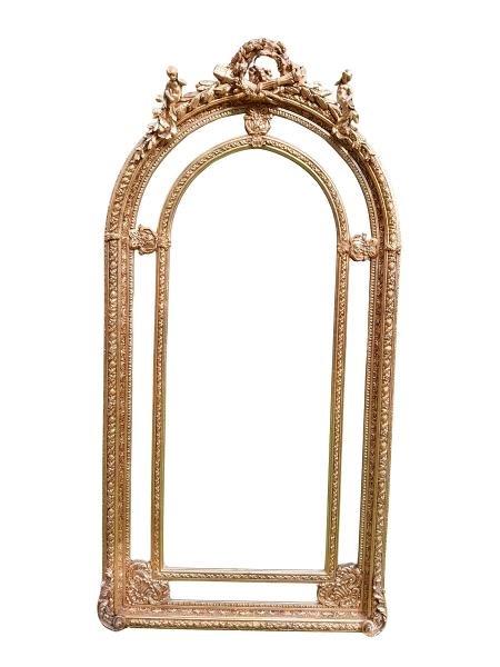 An Ornate Rococo Style Carved Giltwood And Bevelled Mirror