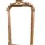 An Ornate Rococo Style Carved Giltwood And Bevelled Mirror