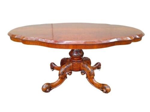 An Antique Victorian Walnut Table With Pie Crust Border on Castors