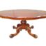 An Antique Victorian Walnut Table With Pie Crust Border on Castors