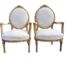 A French Style Pair of Ornately Carved Giltwood Armchairs Upholstered in Original Cream Fabric