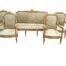 A French Style Ornately Carved Giltwood Settee with 2 Pairs of Armchairs