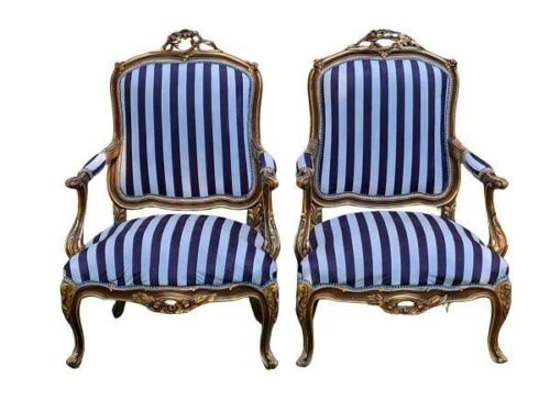 A French Style Pair of Ornately Carved Giltwood Armchairs of Large Proportions Upholstered in Original Fabric