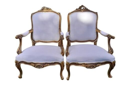 A French Style Pair of Ornately Carved Giltwood Armchairs of Large Proportions Upholstered in Original Fabric