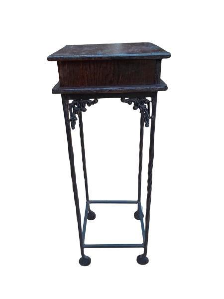 A 20th Century Wood Plinth On Wrought Iron Base