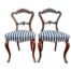 An Antique / Circa 1880s Victorian Pair of Carved Mahogany Chairs 