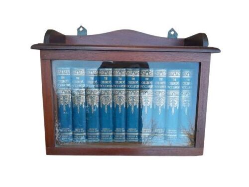 A 20th Century Set Of Ten Volumes Of Children's Encyclopaedia In A Bookcase