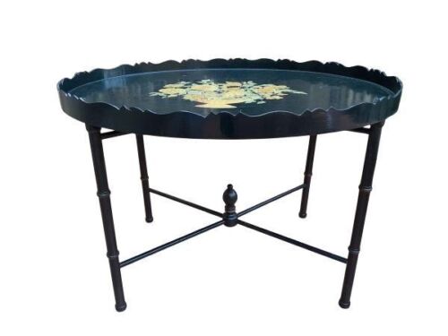 A Black With Floral Design Wooden Table With Detachable Tray