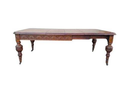 An Antique 19th Century Circa 1890  Victorian Carved  Oak Eight Seater Dining Table / Table With Two Leaves And Crank Handle On Castors