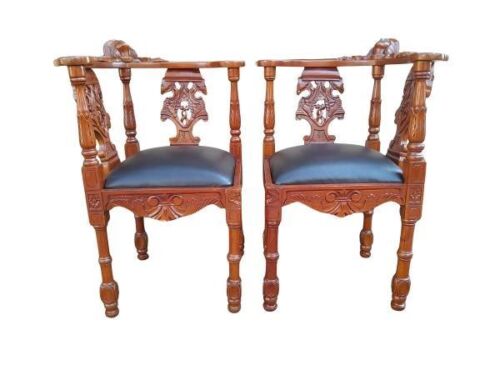 A 20th Century Pair Of Carved Mahogany Corner Chairs