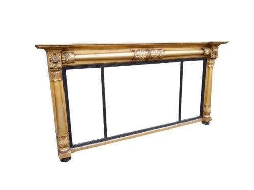 An Antique Circa 1830s Carved And Gilded Mirror