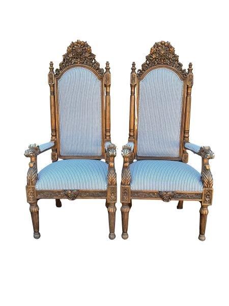 A 20th Century French Style Ornately Carved And Gilded Pair Of Throne Chairs