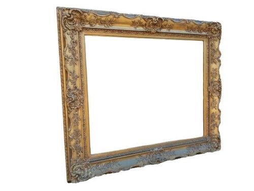 A 20th Century Ornately Carved Giltwood Mirror Of Large Proportions